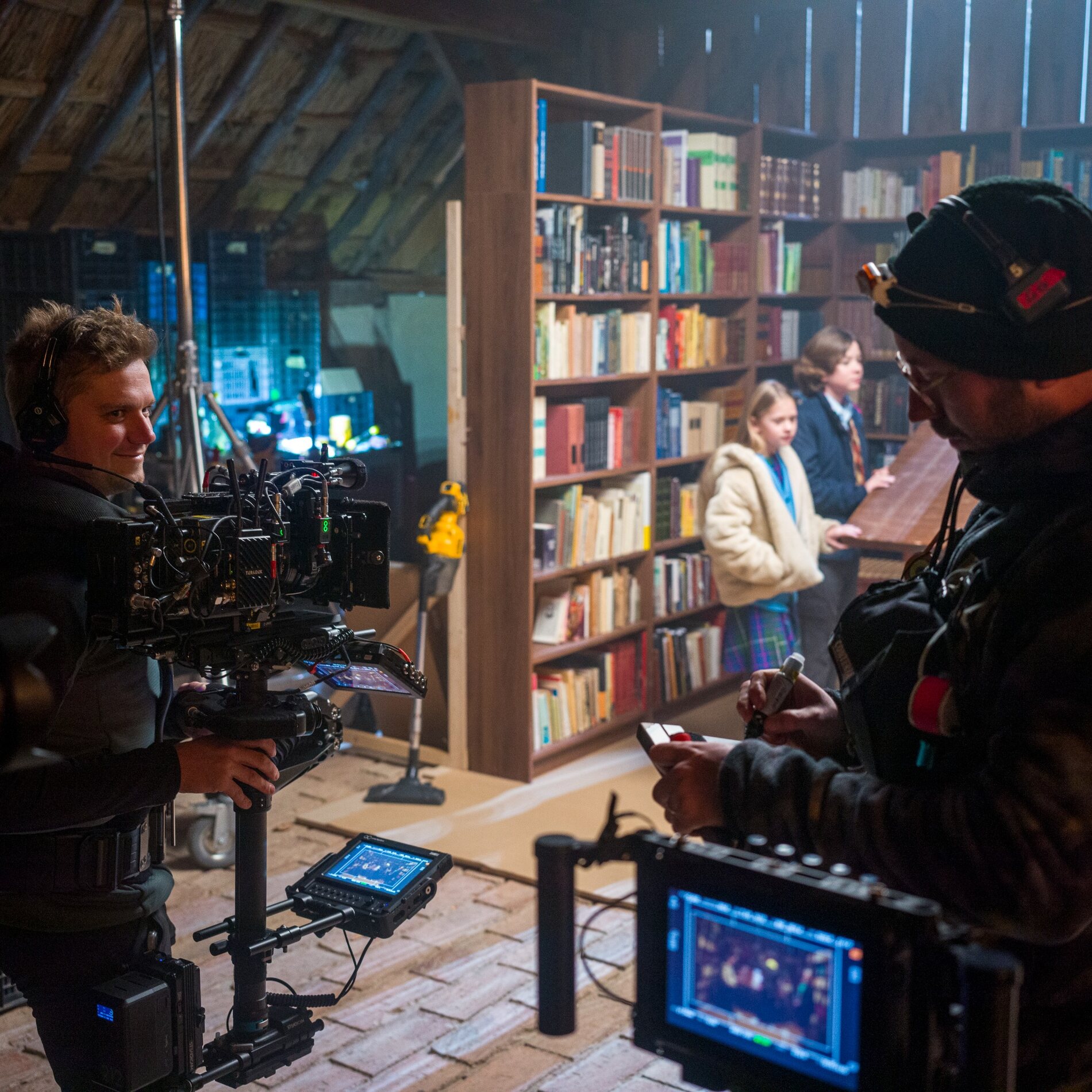 Film crew working on a library set
